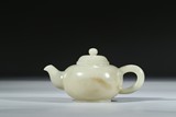 A WHITE JADE CARVED TEAPOT AND COVER