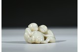 A WHITE JADE CARVING OF MONKEYS AND PEACH