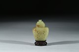 A SMALL YELLOW JADE RETICULATED VASE WITH STAND