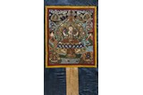 AN EMBROIDERED SILK 'FOUR-ARMED BODHISATTVA' THANGKA