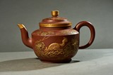 A YIXING MOULDED 'SQUIRRELS' TEAPOT 