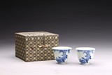 A PAIR OF BLUE AND WHITE 'BIRDS' CUPS