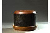 A CIRCULAR INK STONE WITH COVER AND STAND
