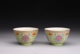 A PAIR OF FAMILLE ROSE GREEN GROUND 'LOTUS' BOWLS 