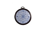 A LARGE BLUE AND WHITE CIRCULAR HANGING PANEL