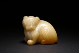 A WHITE JADE CARVING OF MYTHICAL BEAST