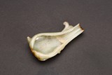 A SMALL WHITE JADE CARVED WASHER