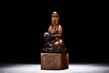 A SOAPSTONE FIGURE OF GUANYIN CARVED SEAL