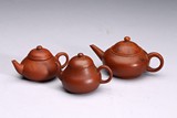 A GROUP OF THREE YIXING CLAY TEAPOTS