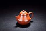 A YIXING RED CLAY PEAR-SHAPED TEAPOT
