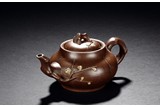 A YIXING ZISHA 'PLUM' TEAPOT