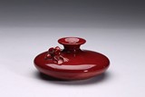A SMALL RED GLAZE 'FROG' VASE