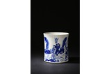 A BLUE AND WHITE 'FIGURES' BRUSHPOT