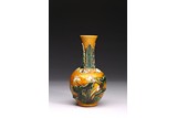 A YELLOW GLAZE CARVED 'LOTUS' VASE