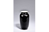 A BLACK GLAZED VASE