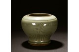 A CELADON GLAZED INSCRIBED JAR