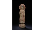 A MARBLE CARVED STANDING BUDDHA STATUE