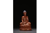 A RED LACQUER WOODEN STATUE OF BUDDHA