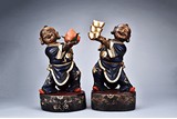 A PAIR OF LACQUERED WOODEN CARVED BOY FIGURES