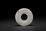 AN ARCHAISTIC WITH WHITE JADE CARVED DISC