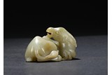 A CELADON JADE CARVING OF HORSE