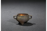 A MINIATURE BRONZE TRIPOD CENSER