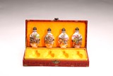 A SET OF FOUR ENAMELED 'FIGURES' SNUFF BOTTLES