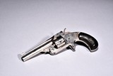 AN ANTIQUE 1877 SMITH & WESSON REVOLVER