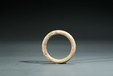 A CALCIFIED JADE 'CHILONG AND INSCRIPTION' BANGLE