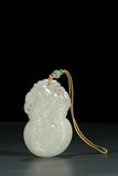 A CHINESE WHITE JADE 'DOUBLE GOURD' PENDANT