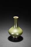 A CHINESE TEA-DUST GLAZED BOTTLE VASE WITH STAND