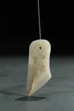A WHITE JADE INSCRIBED CARVING
