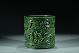 A CHINESE GREEN JADE 'LANDSCAPE' BRUSHPOT