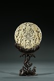 A WHITE JADE RETICULATED PLAQUE WITH WOOD STAND
