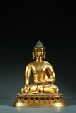 A TIBETAN GILT BRONZE FIGURE OF SHAKYAMUNI