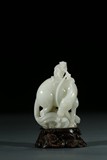 A WHITE JADE CARVING OF MONKEY AND HORSE