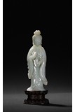 A WHITE JADE FIGURE OF STANDING GUANYIN