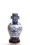 A CHINESE BLUE AND WHITE VASE WITH STAND
