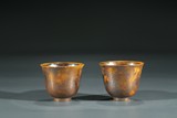 A PAIR OF YELLOW AND RUSSET GLAZED CUPS