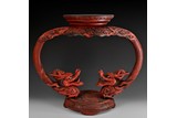 A LACQUER WOOD CARVED DRAGONS STAND