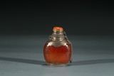 A SILVER MOUNTED AMBER SNUFF BOTTLE