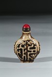 A STONE CARVED DRAGON SNUFF BOTTLE
