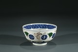 A CHINESE FAMILLE ROSE AND BLUE BOWL
