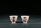 A CHINESE PAIR OF RED GLAZED 'BAMBOO' CUPS