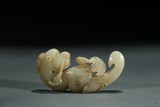 A JADE CARVED MYTHICAL BEAST