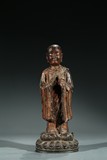 A CHINESE GILT LACQUER BRONZE FIGURE OF ANANDA