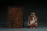 A CHINESE BROWN GLAZED CARVED VASE
