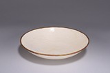 A DING-TYPE WHITE GLAZE 'DRAGON' DISH