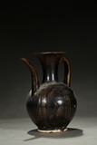 A BROWN GLAZED EWER
