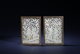 A PAIR OF WHITE JADE FRAMED SHELVES